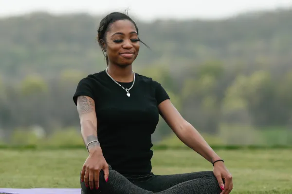 yoga and mediation outside on grass